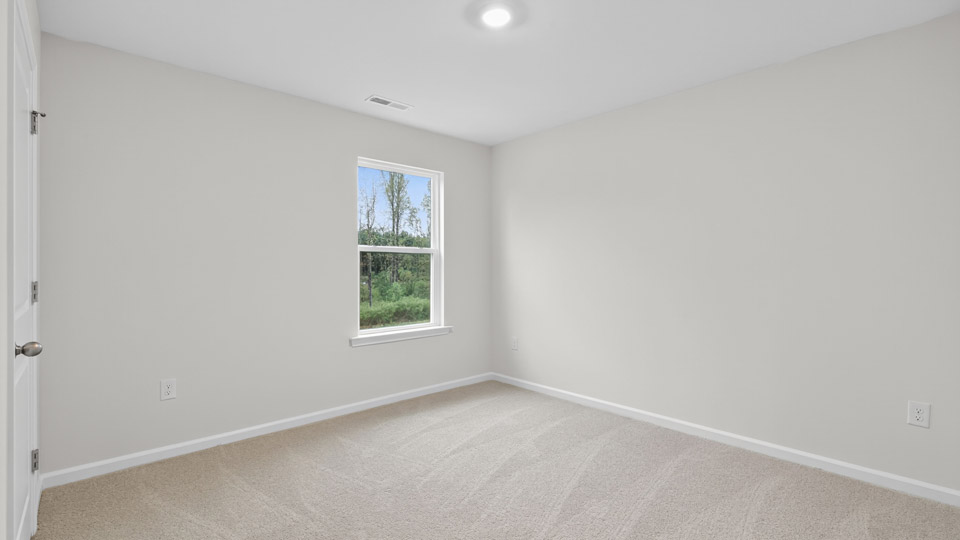 loft with carpet flooring