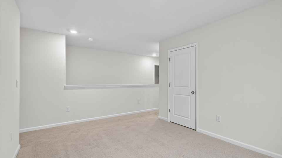 loft with carpet flooring