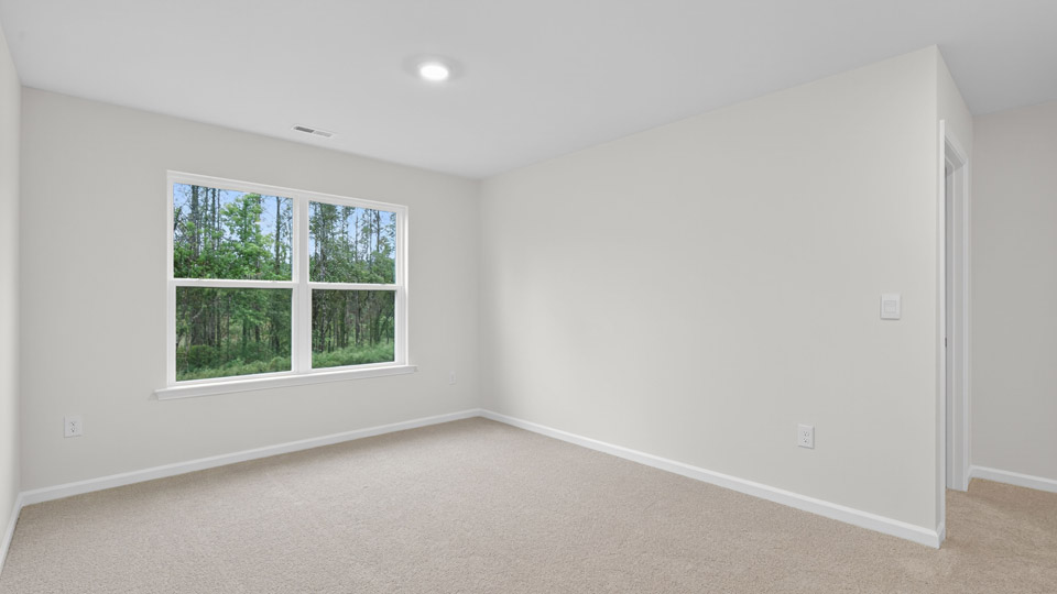 loft with carpet flooring