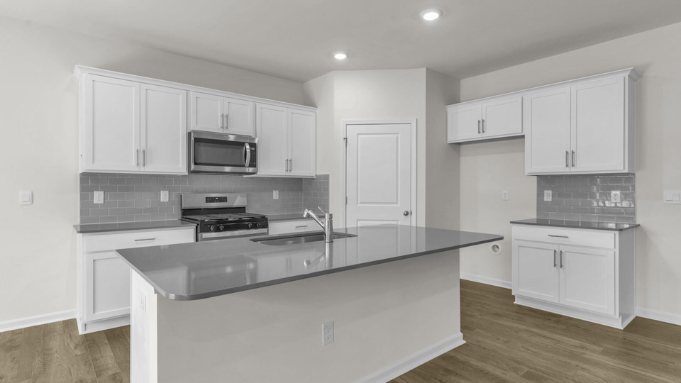 kitchen with quartz countertops and stainless steel appliances