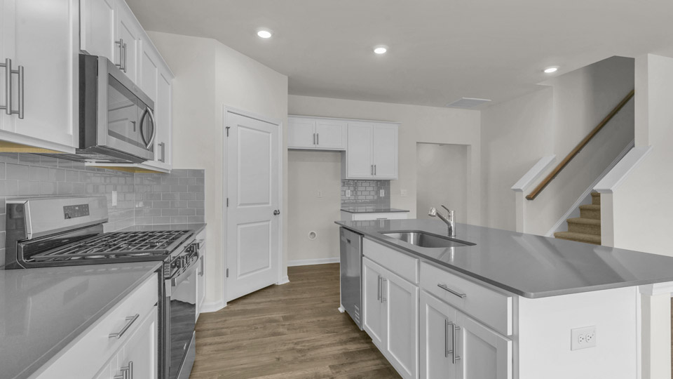 kitchen with quartz countertops and stainless steel appliances