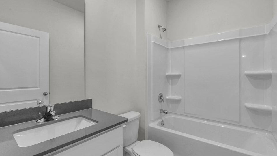 bathroom with quartz countertops