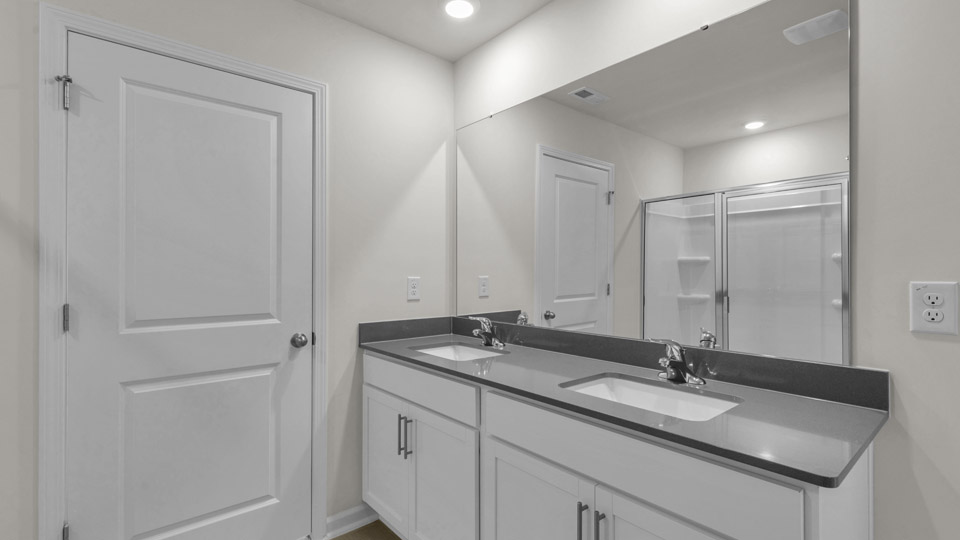 bathroom with quartz countertops