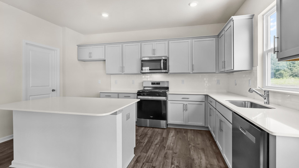 kitchen with quartz countertops and stainless steel appliances