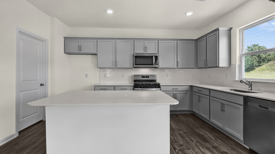 kitchen with quartz countertops and stainless steel appliances