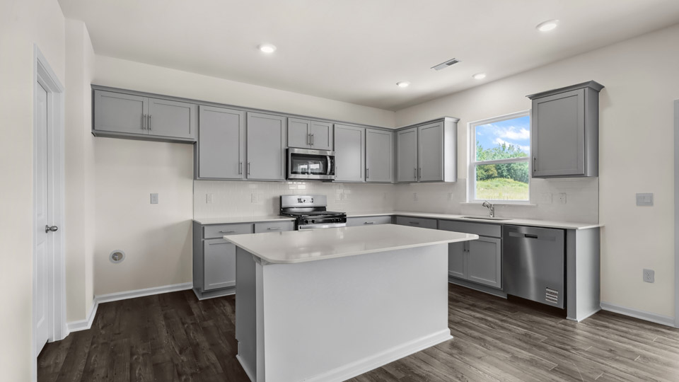 kitchen with quartz countertops and stainless steel appliances