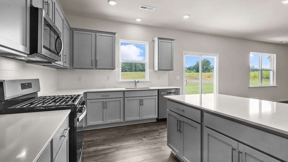 kitchen with quartz countertops and stainless steel appliances