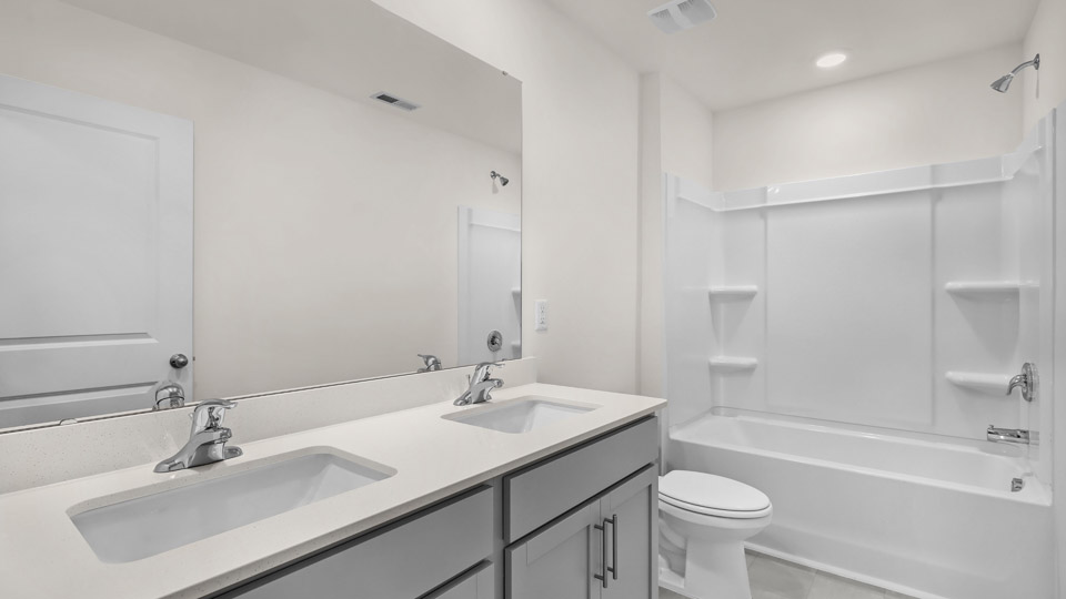 bathroom with quartz countertops