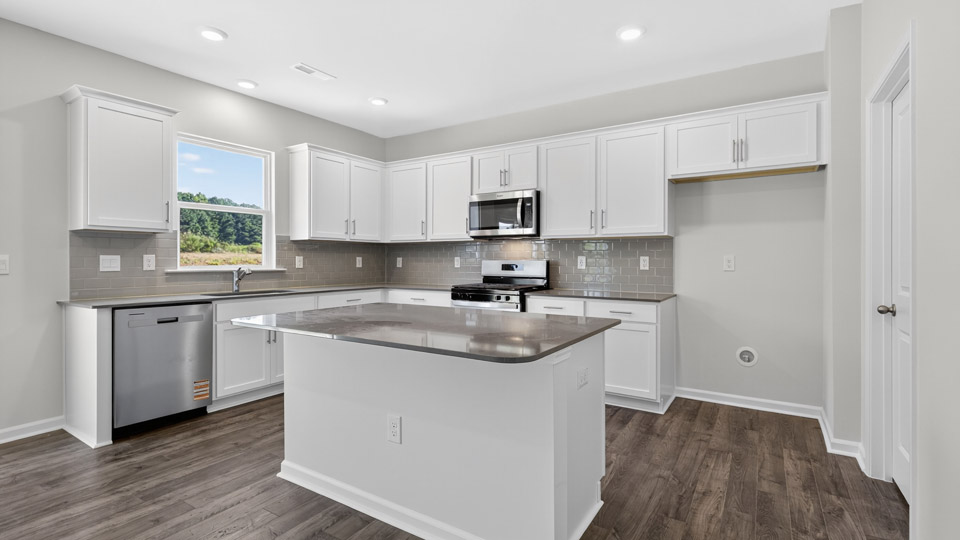 kitchen with white cabinets and quartz countertops
