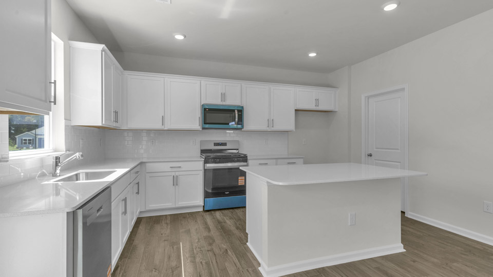 kitchen with quartz countertops and stainless steel appliances