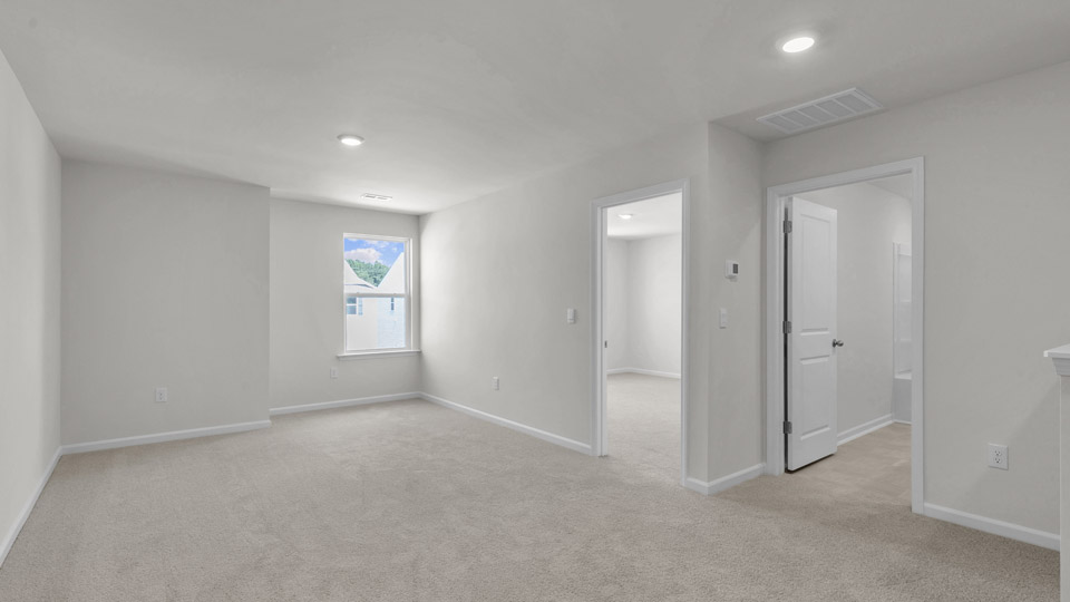 loft with carpet flooring