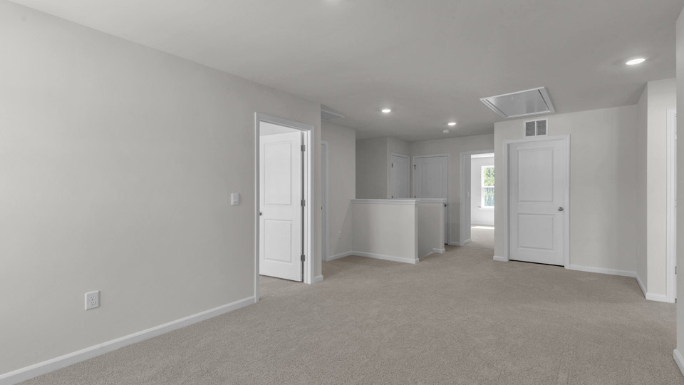 loft with carpet flooring