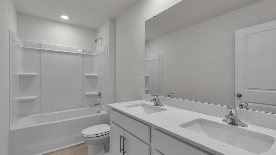 bathroom with quartz countertops