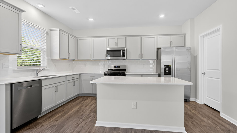 kitchen with stainless steel appliances and quartz countertops