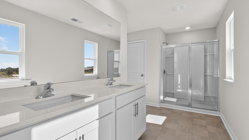 bathroom with quartz countertops and separate sinks