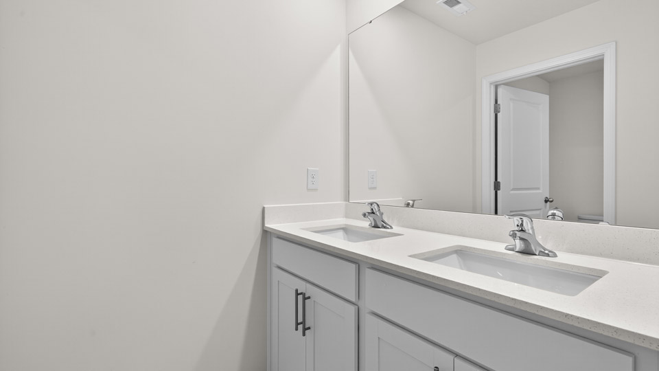 bathroom with quartz countertops