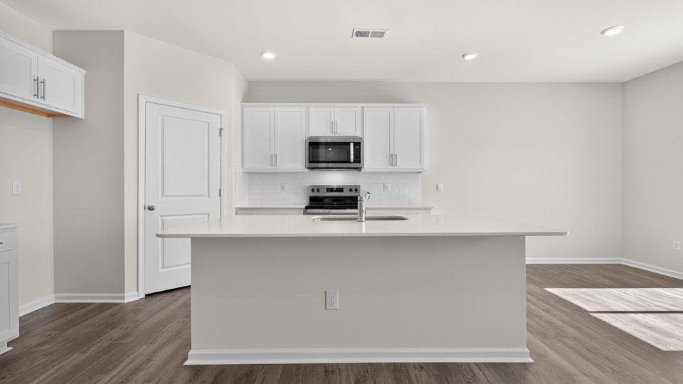 kitchen with white cabinets quartz countertops and stainless steel appliances
