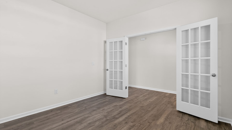 study with revwood flooring and french doors