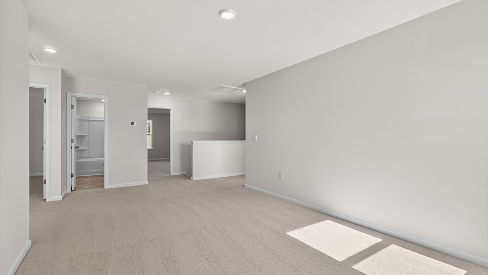 loft with carpet flooring