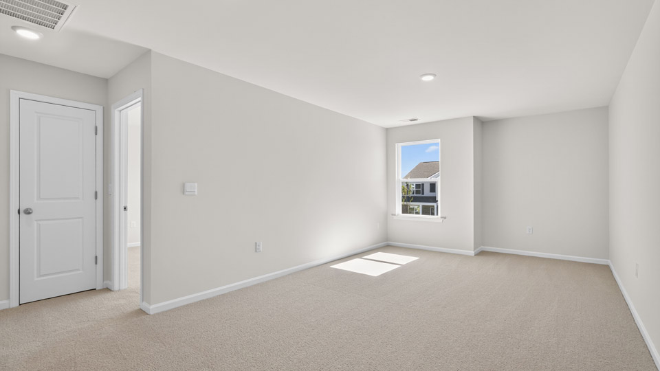 loft with carpet flooring