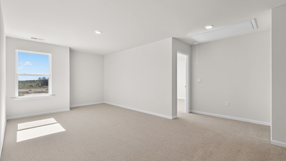 loft with carpet flooring