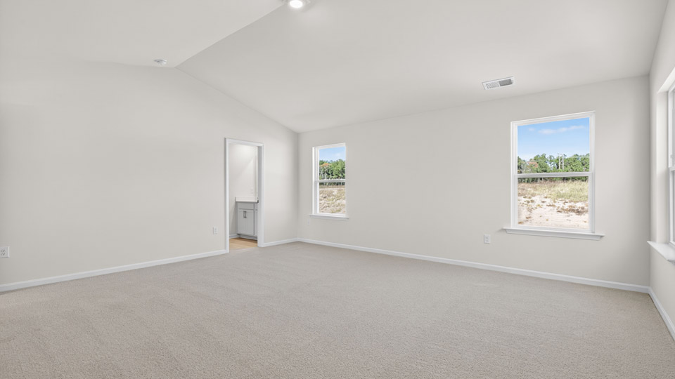 bedroom with vaulted ceiling