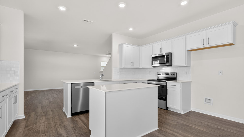 breakfast area with revwood flooring and sliding glass doors