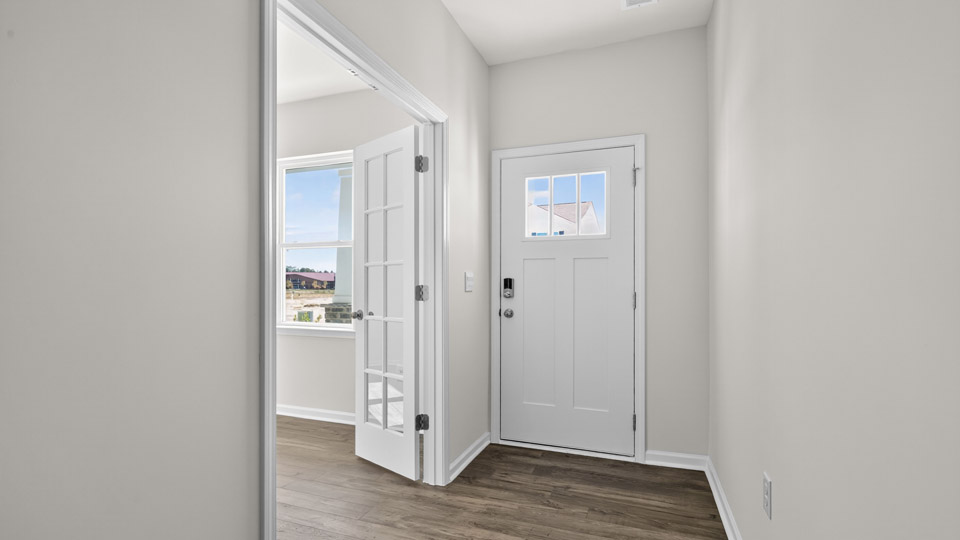 foyer entryway with revwood flooring