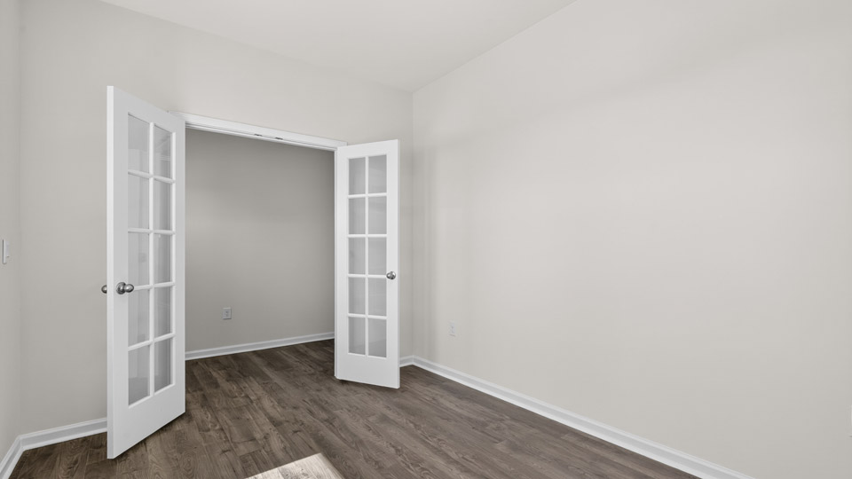 study with french doors and revwood flooring