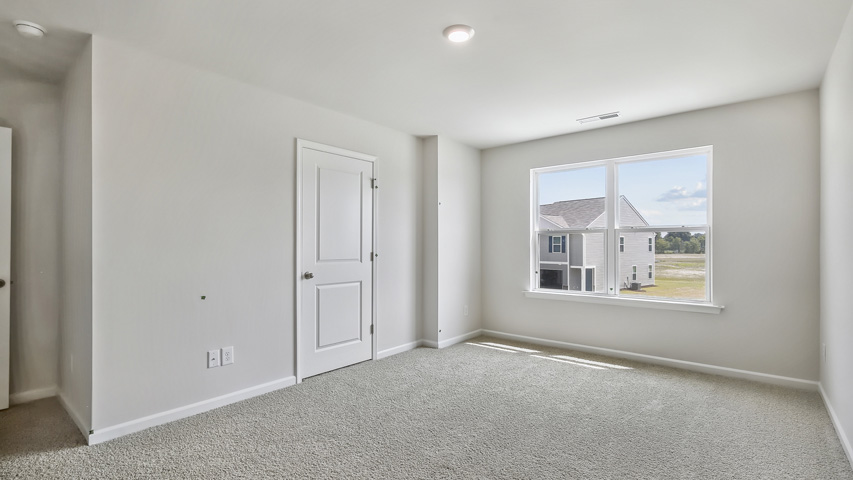 Bedroom with carpet flooring