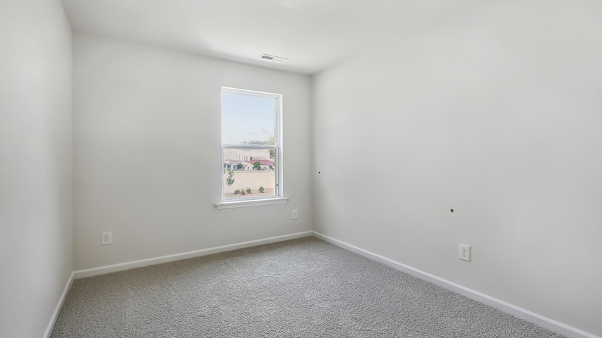 Bedroom with carpet flooring