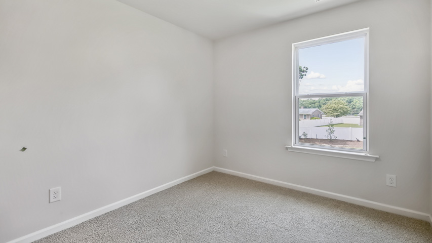 Bedroom with carpet flooring