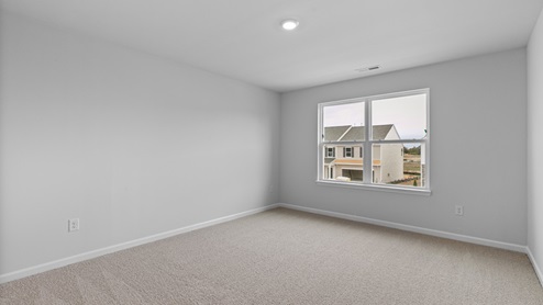 Bedroom with carpet flooring