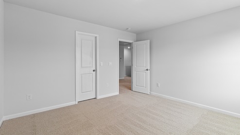 Bedroom with carpet flooring