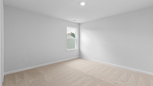 Bedroom with carpet flooring