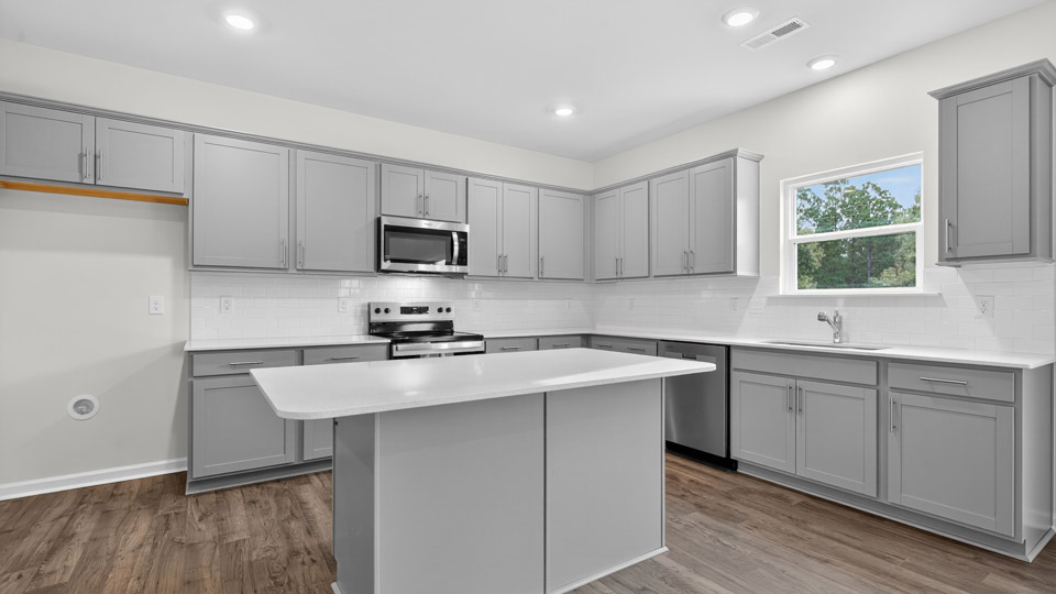 kitchen with gray cabinets and quartz countertops