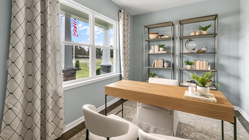 Study with ample lighting and revwood flooring and french doors