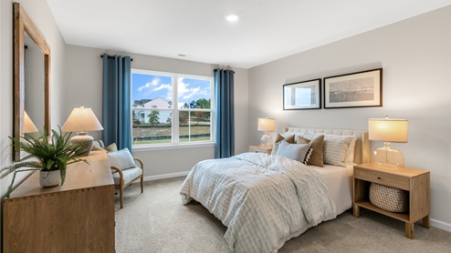 Bedroom with natural lighting and carpet flooring
