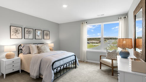 Bedroom with natural lighting and carpet flooring