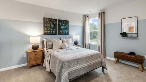 Bedroom with natural lighting and carpet flooring