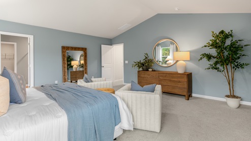 Bedroom with natural lighting and carpet flooring