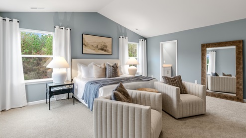 Bedroom with natural lighting and carpet flooring