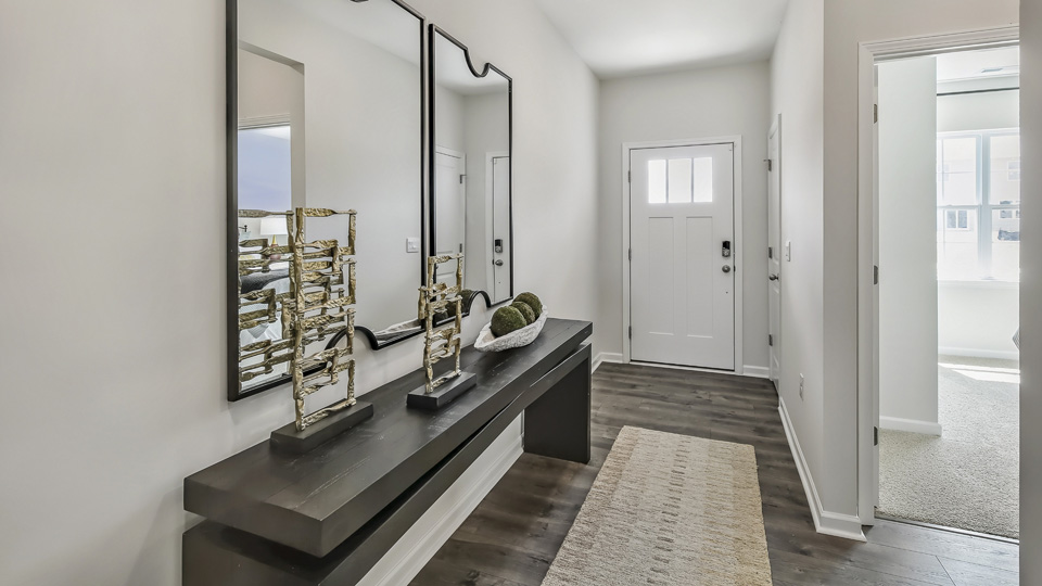 foyer entryway with revwood flooring