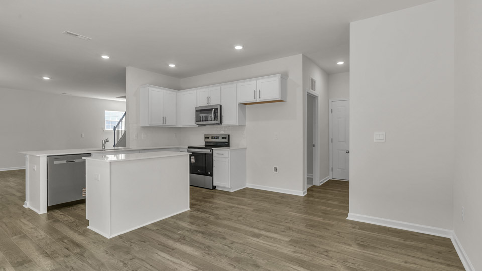 Kitchen with quartz countertops and stainless steel appliances