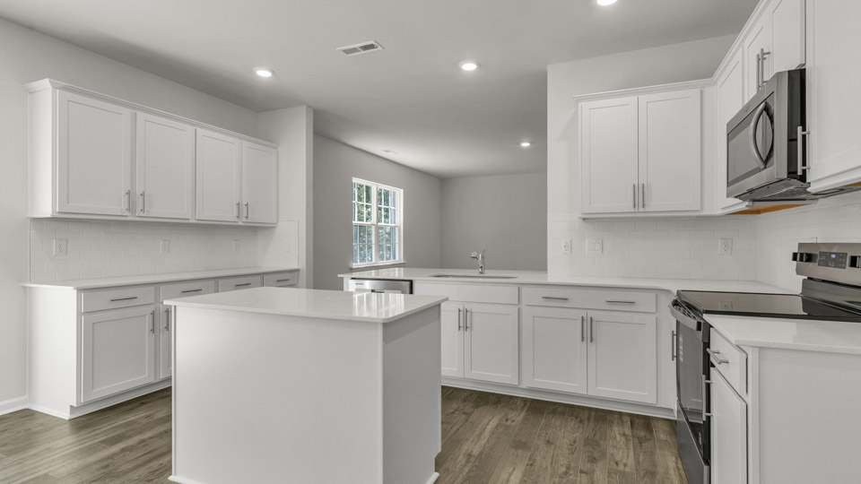 Kitchen with quartz countertops and stainless steel appliances