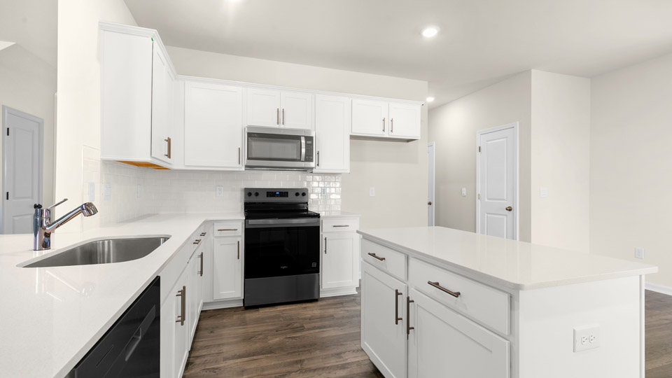 kitchen with quartz countertops and stainless steel appliances