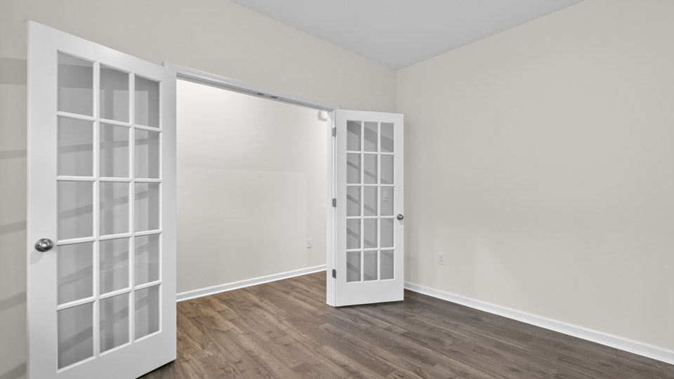 study with french doors and revwood flooring