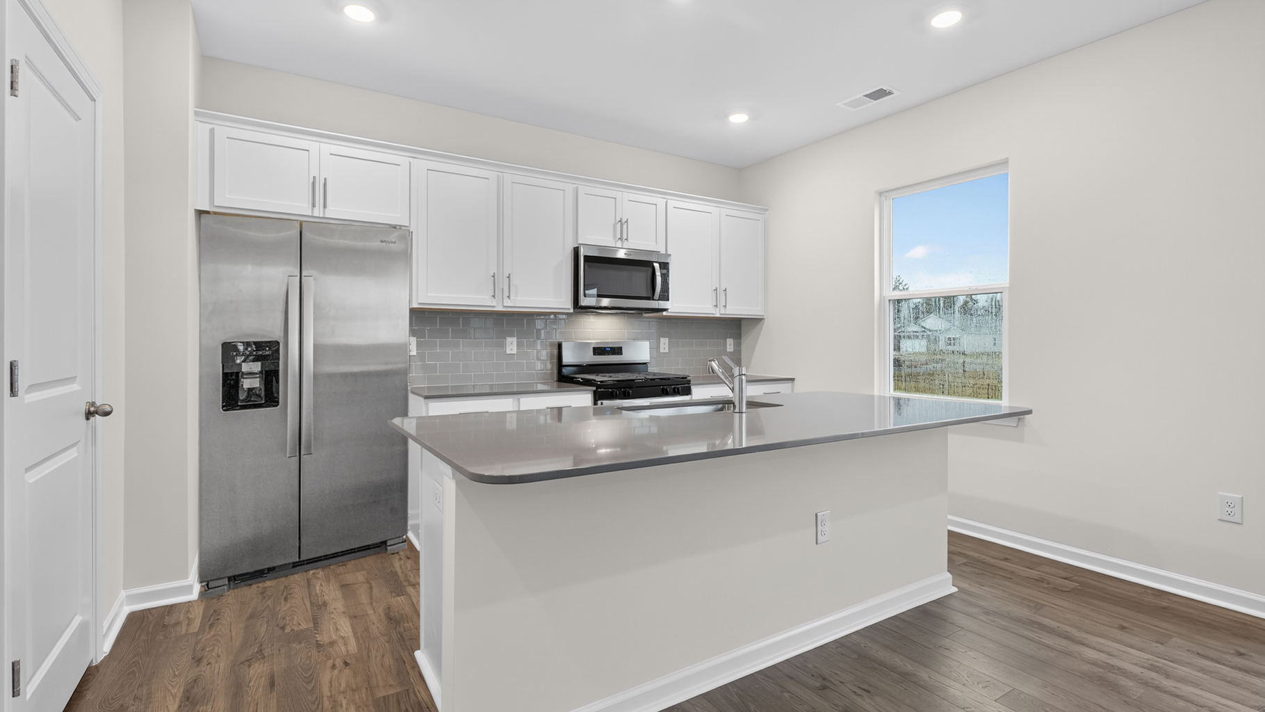 kitchen with white cabinets and quartz countertops