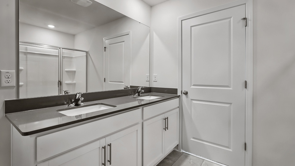 Bathroom with white cabinets