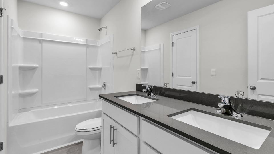 Bathroom with white cabinets